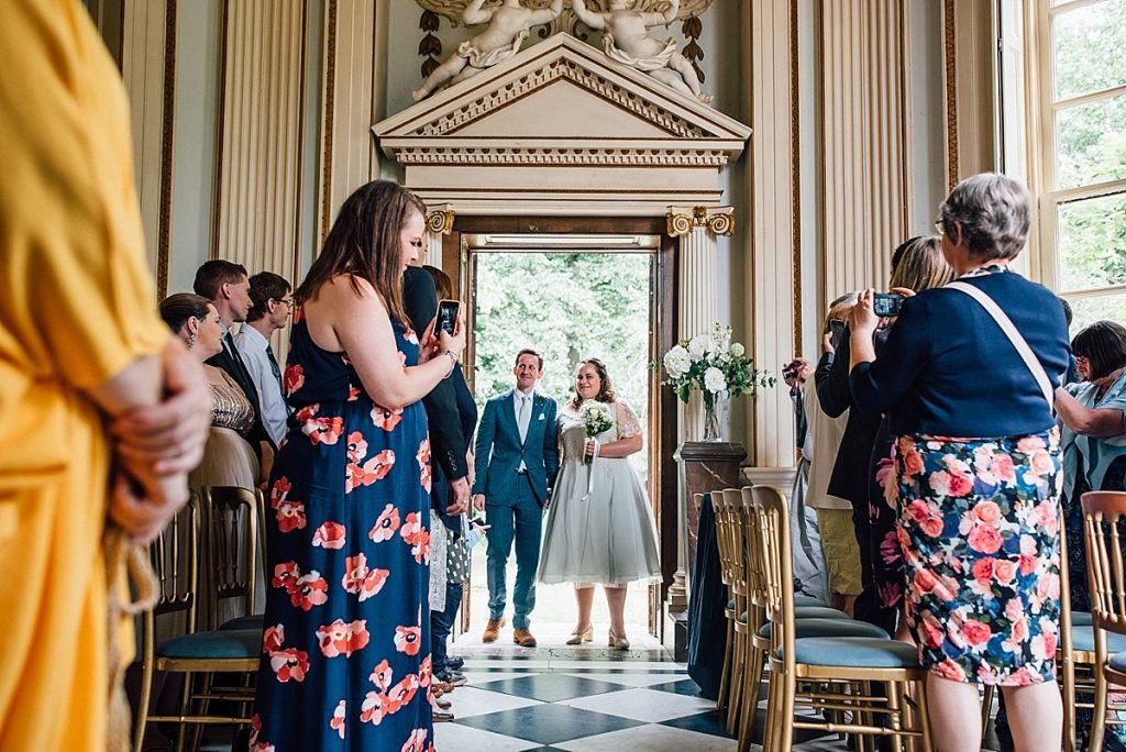 bride and groom enter ceremony taken by Parrot & Pineapple Wedding Photography