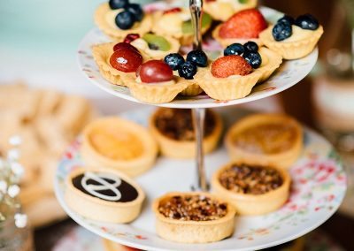 bite sized cakes on tiered cake stand taken by Parrot & Pineapple Wedding Photography