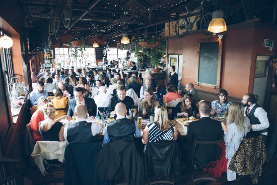 guests sitting and eating wedding breakfast