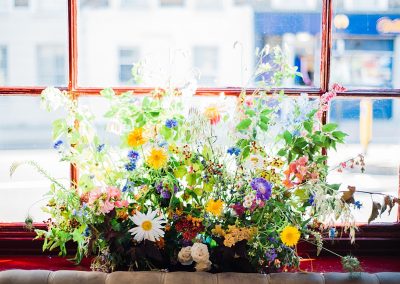 Wedding flowers in the windows at Gipsy Queen pub