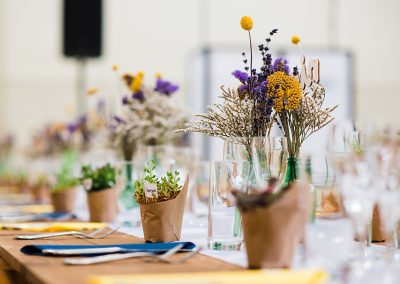 florals and mini plant pots on wedding breakfast table taken by Parrot & Pineapple Wedding Photography