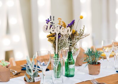 wood cut number eleven on wedding breakfast table taken by Parrot & Pineapple Wedding Photography