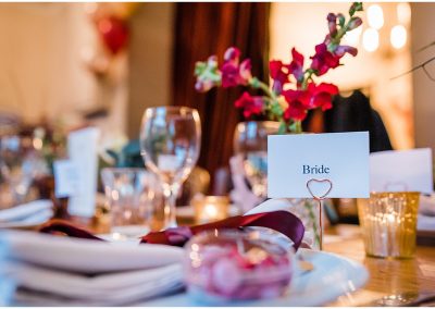 pub wedding table setting with table flowers name cards