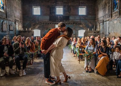 Couple kiss at wedding in unique wedding venue asylum chapel - image by Parrot and Pineapple Wedding Photography