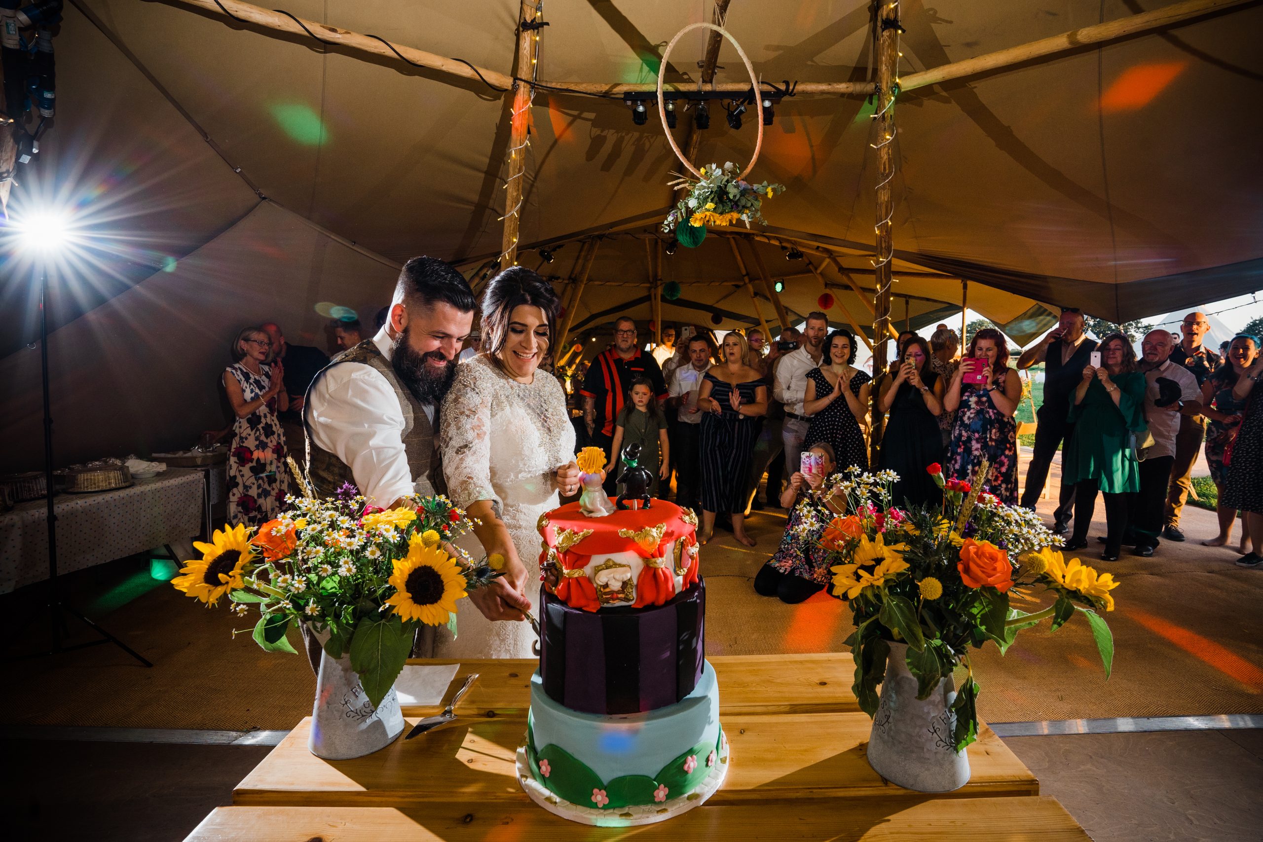 Bride and groom cutting quirky cake Kingstanding-Farm-Wedding